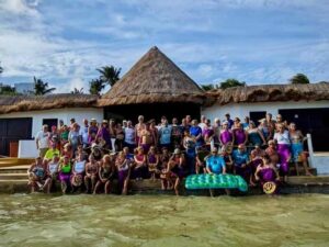 2024 Cancun XGOs group in purple pareos